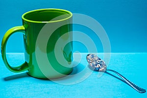 Spoon and cup with microplastics