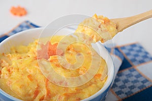 Spoon with dairy semolina and carrots
