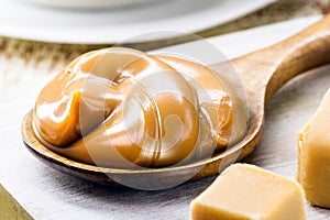 spoon of dulce de leche or homemade sweet caramel, called Dulce de lethe in Brazil