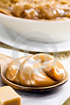 spoon of dulce de leche or homemade sweet caramel, called Dulce de lethe in Brazil