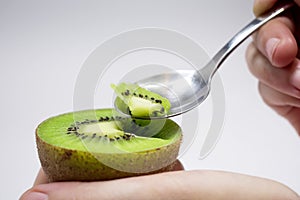Spoon Feeding a Kiwi