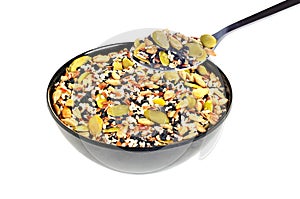Spoon with flax seeds, sunflower seeds, sesame, chia and pumpkin seeds