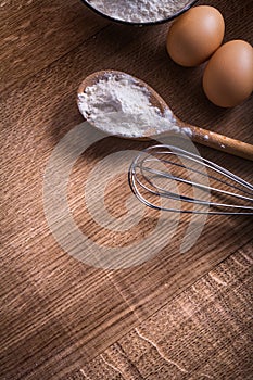 Spoon with flour corolla eggs