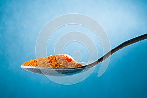 Spoon with a food ingredient grain