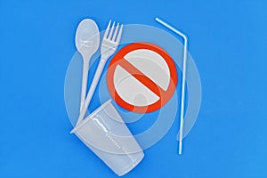 Spoon and fork on ban sign. Disposable single-use plastic objects causing pollution of the environment, especially the oceans. Top