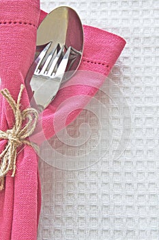 Spoon and Fork with pink serviette