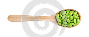 Spoon with fresh edamame soybeans on white background, top view