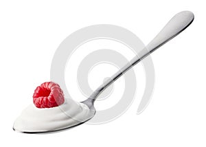 Spoon of fresh greek yogurt and raspberry on white background