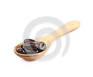 Spoon full of chocolate candies