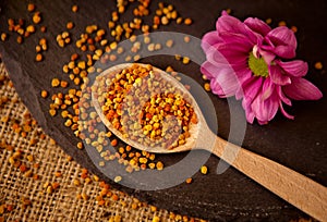 Spoon full of granule pollen- Bee Pollen