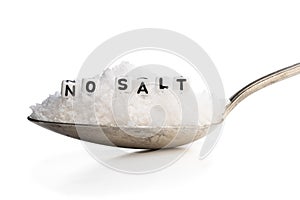 Spoon full of sea salt. No salt concept