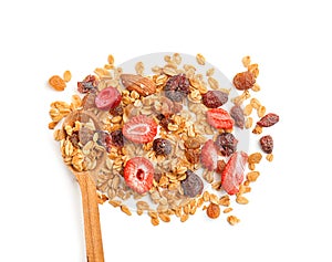 Spoon with granola on white background