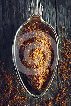 Spoon of ground nutmeg powder