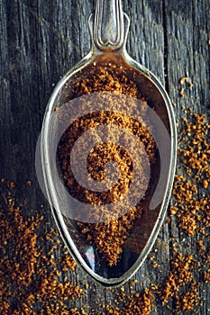 Spoon of ground nutmeg powder