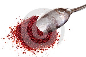 Spoon and ground sumac spice