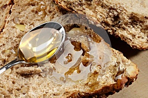 Spoon with honey and bread