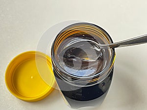 Spoon in jar of Yeast extract marmite jar from above photo