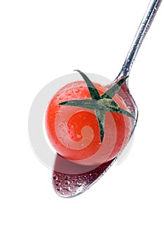 Spoon with little tomato