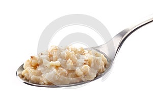 Spoon of oats porridge