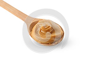 Spoon with peanut butter isolated on white background