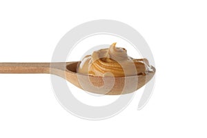 Spoon with peanut butter isolated on white background