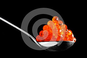 Spoon with red caviar photo