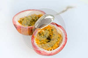 Spoon Resting on an Open Passion Fruit