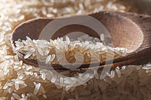 Spoon with rice seeds photo