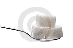 Spoon with sugar cubes isolated