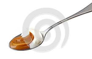 Spoon of yogurt and soft caramel