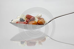 Spoonful of different pills