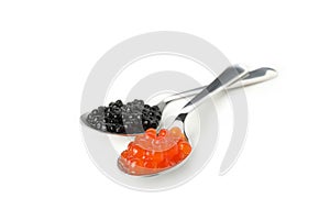 Spoons with black and red caviar isolated on white background