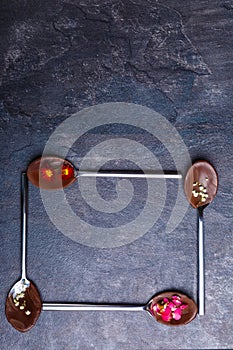 Spoons with frozen chocolate, spoons lies in the form of a square bottom