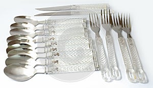 Spoons and knifes and forks transparent handle