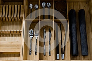 Spoons and other cutlery in a wooden box