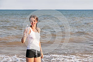 Sport active woman drinking water after exercising
