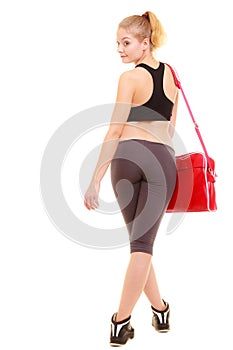 Sport. Back of fitness sporty girl in sportswear with gym bag