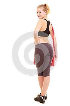 Sport. Back of fitness sporty girl in sportswear with gym bag