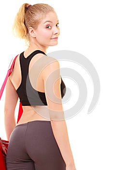 Sport. Back of fitness sporty girl in sportswear with gym bag