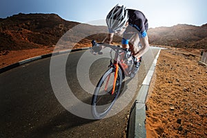 Sport background. Athletic man cycling road bike.