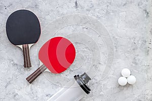 Sport background. Traning cocept. Ping pong racket and water on grey background top view copyspace