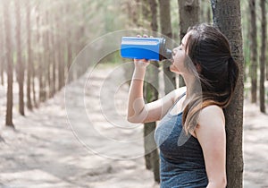 Sport beautiful young woman girl lifestyle exercise healthy drinking protein water after running workout
