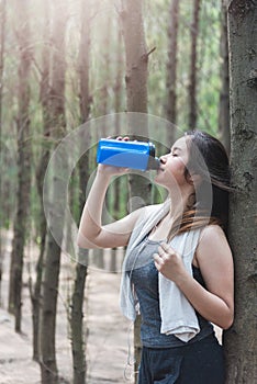Sport beautiful young woman girl lifestyle exercise healthy drinking protein water after running workout