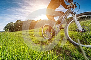 Sport bike, cycling in the beautiful meadow, detail photo