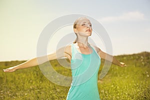 Sport blond woman exercising in the outdoors yoga photo on nat