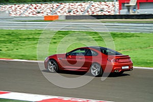 Sport car fast moving on track