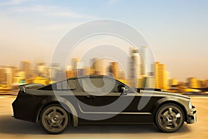 Sport car speeding in front of New York City skyline