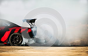Sport car wheel drifting and smoking on track