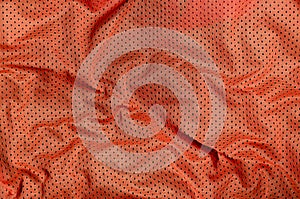 Sport clothing fabric texture background, top view of red cloth textile surfac