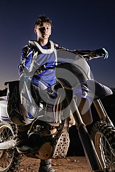 Sport, competition and portrait of man with off road motorbike, confidence and gear for race challenge. Adventure